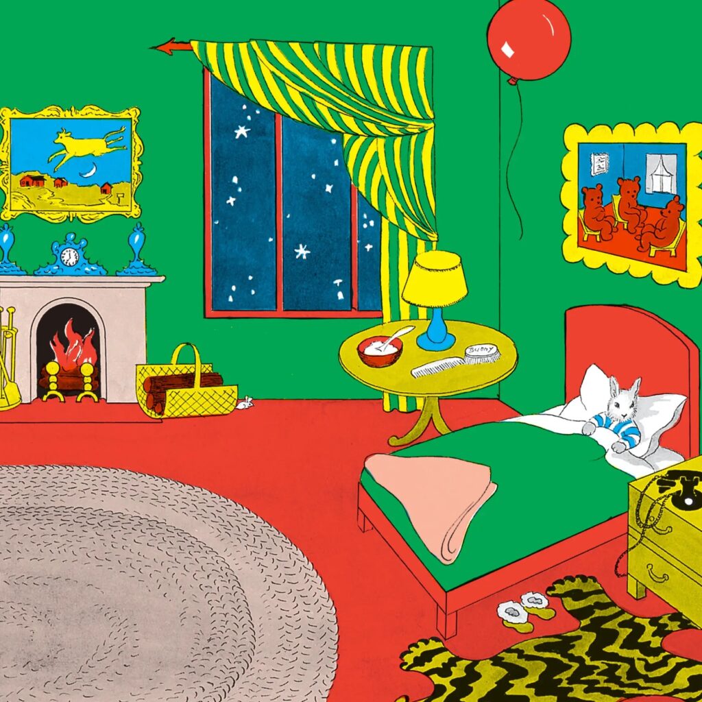 The first page of Goodnight Moon - an illustration of a room with green walls with two pictures hanging on the walls, a fireplace on one side of the room, and a window looking out at a starry night sky. A small bunny is dressed in pajamas tucked in bed. The floor is red with a brown circular rug and a small tiger rug next to the bed. There is a red balloon floating above the bunny, a small table with a lamp, and a night stand with a phone and a clock.